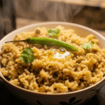 Vegetable khichuri cooking in microwave bowl.